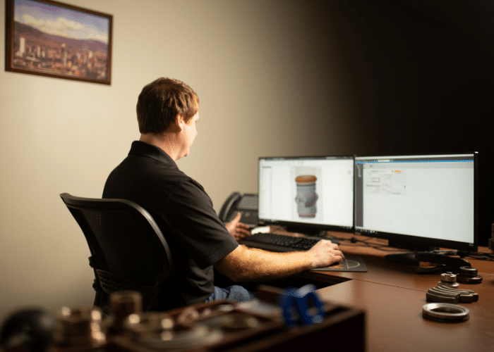 M&M International employee working on his computer